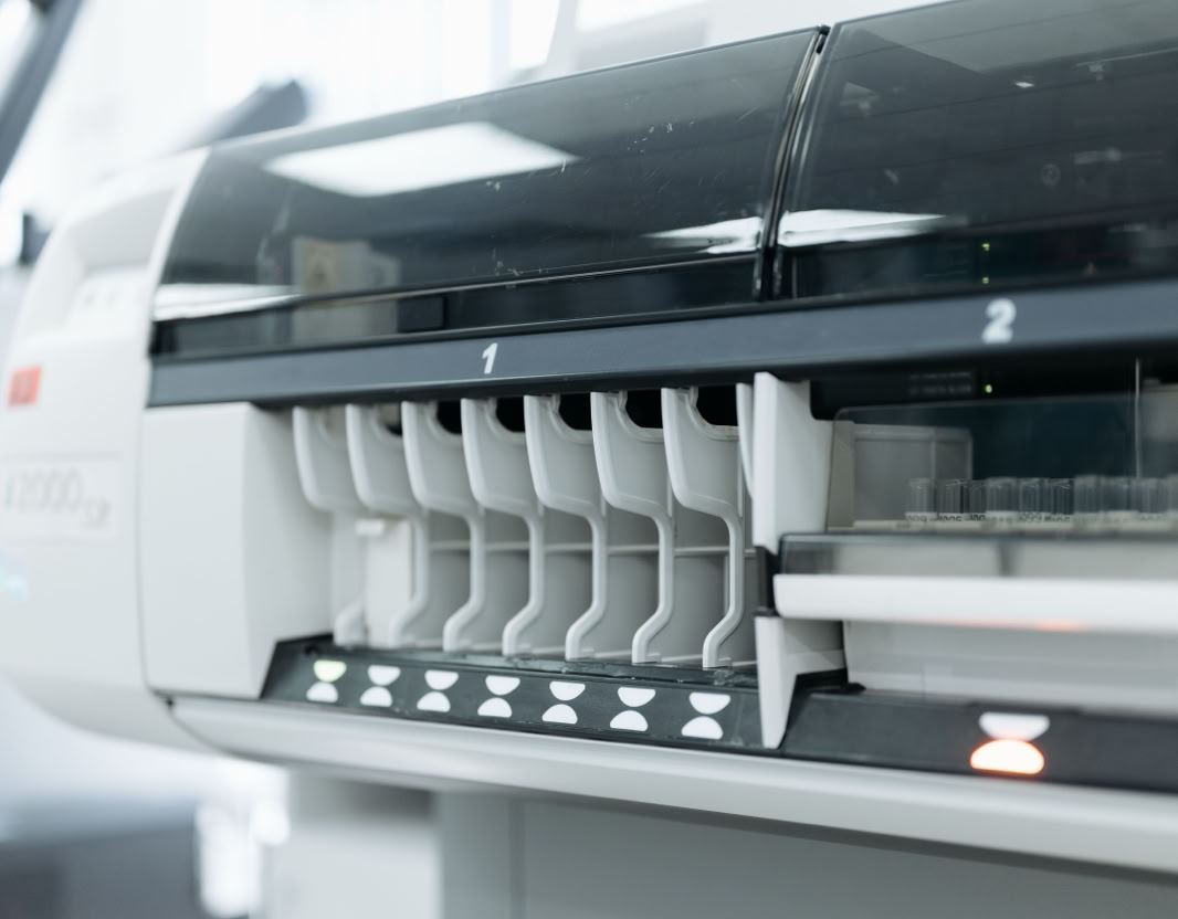 A close-up of advanced laboratory testing equipment used for medical and scientific research in a sterile environment.
